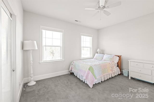 bedroom with baseboards, visible vents, carpet, and ceiling fan