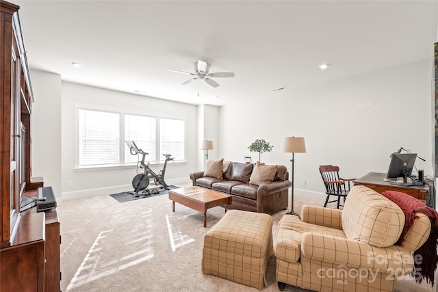 living area with a ceiling fan, baseboards, recessed lighting, and carpet flooring