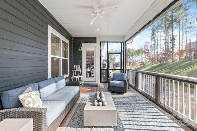 sunroom / solarium featuring an outdoor hangout area and a ceiling fan