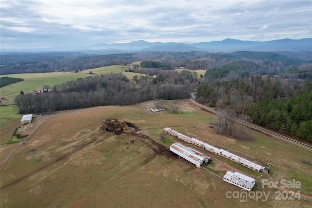 drone / aerial view with a mountain view and a rural view