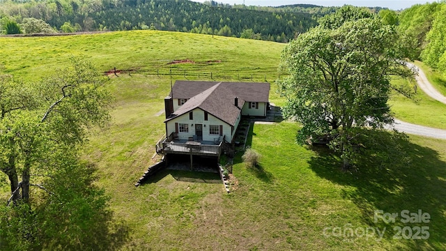 bird's eye view featuring a rural view and a wooded view