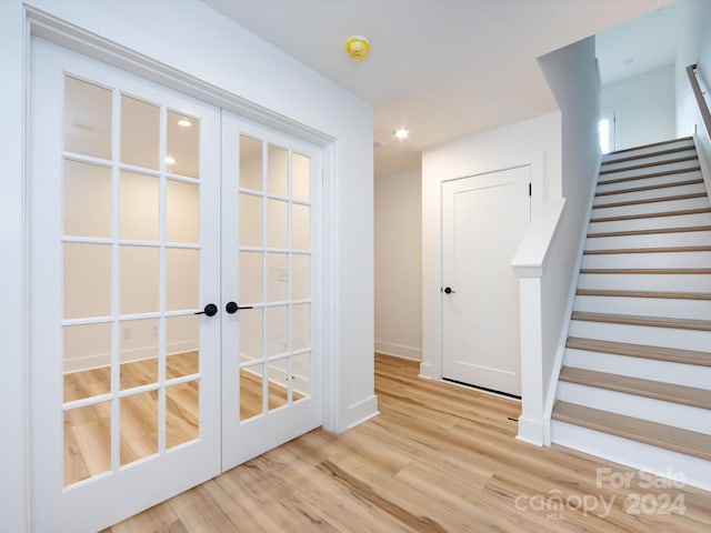 7022 Impulse Ct, Charlotte, NC 28205 - interior space with french doors, light wood-style flooring, stairway, and recessed lighting