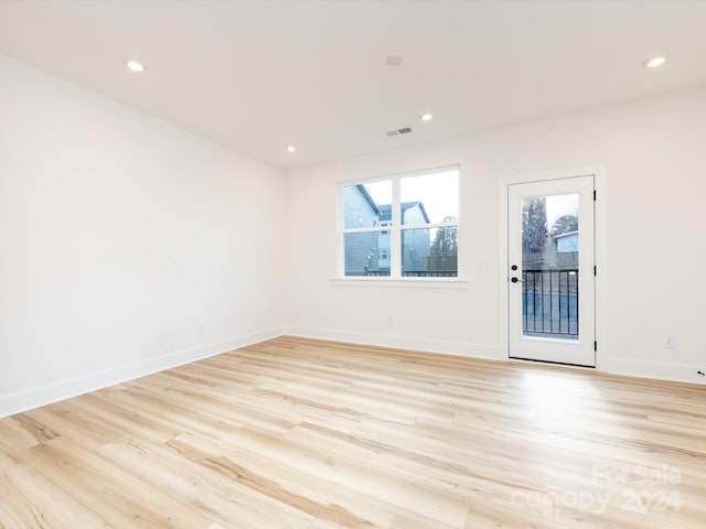 7022 Impulse Ct, Charlotte, NC 28205 - unfurnished room featuring light wood-style floors and recessed lighting