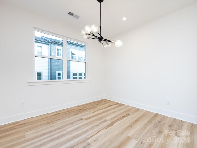7022 Impulse Ct, Charlotte, NC 28205 - unfurnished room featuring a chandelier, wood finished floors, and recessed lighting