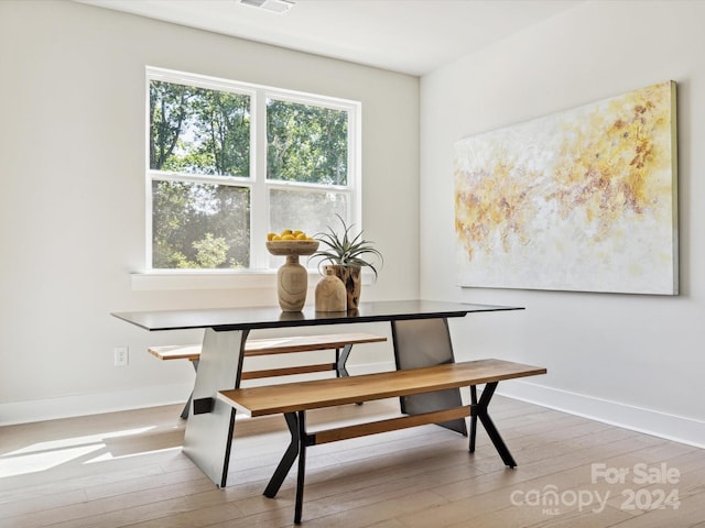 dining room with wood-type flooring