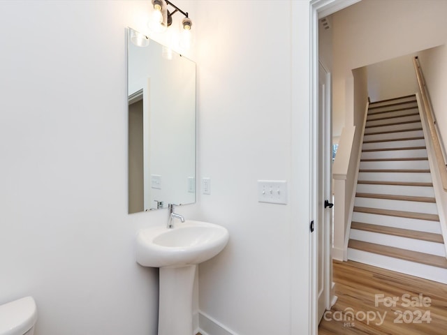 7022 Impulse Ct, Charlotte, NC 28205 - bathroom featuring toilet and wood finished floors