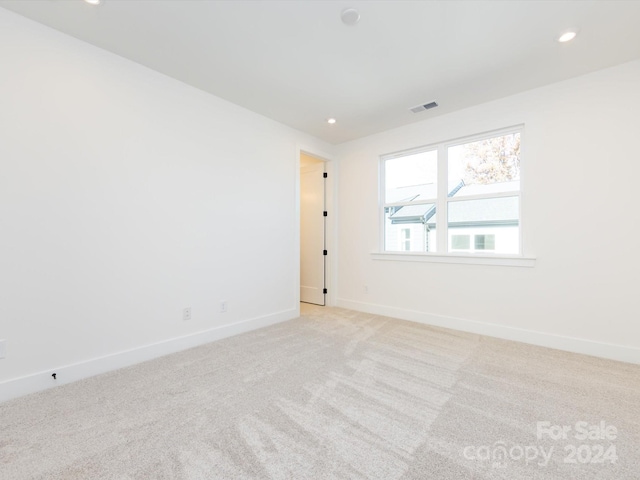 7022 Impulse Ct, Charlotte, NC 28205 - unfurnished room with light carpet and recessed lighting
