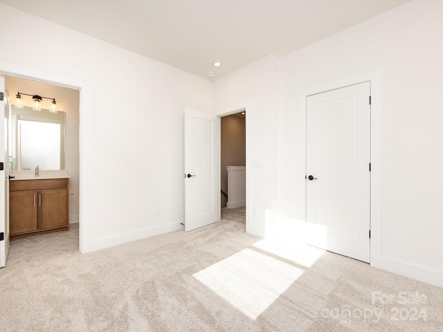 7022 Impulse Ct, Charlotte, NC 28205 - unfurnished bedroom with light colored carpet and connected bathroom