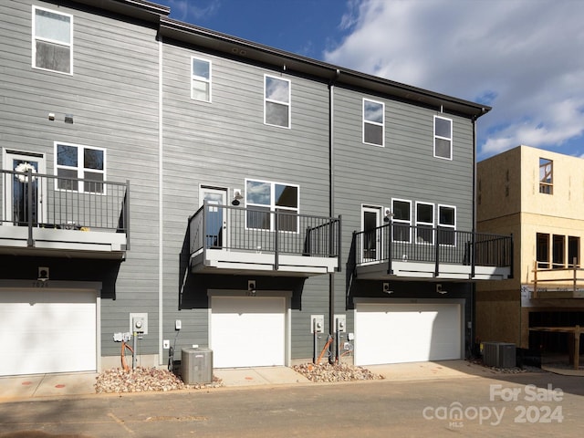 7022 Impulse Ct, Charlotte, NC 28205 - back of house with a garage and a balcony