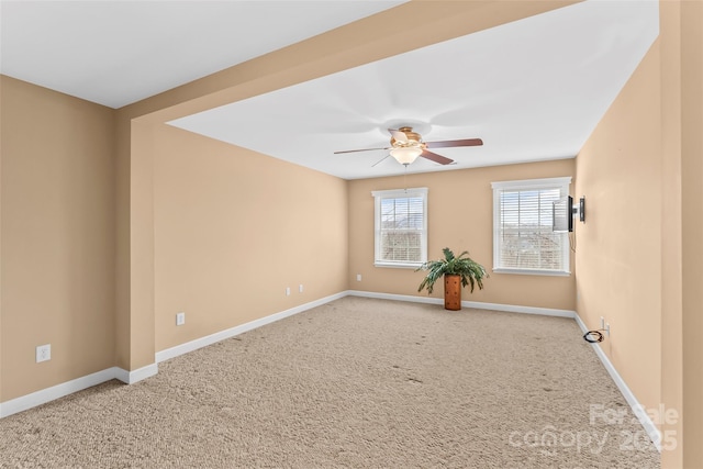 empty room with ceiling fan and carpet