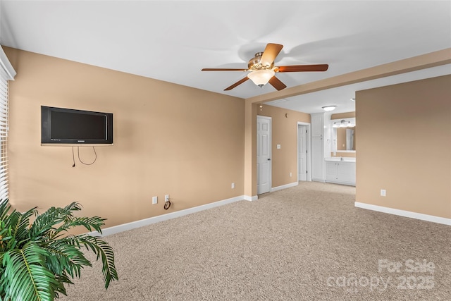 carpeted empty room with ceiling fan