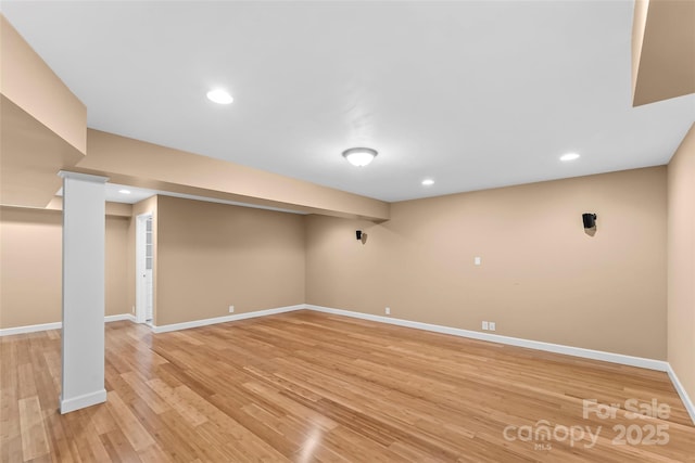 basement featuring light hardwood / wood-style flooring