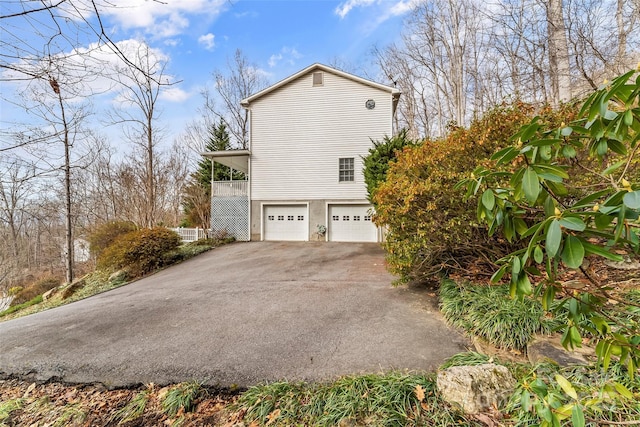 view of side of property featuring a garage