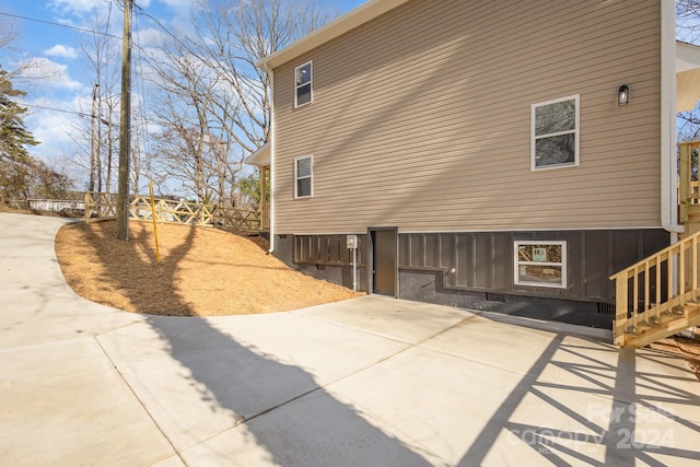 view of side of property with a patio area