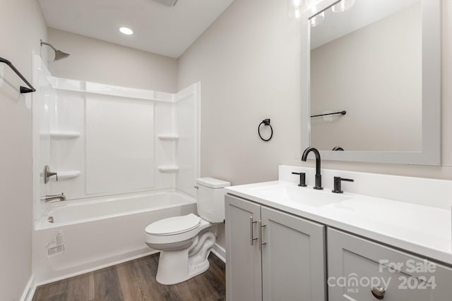 full bathroom with hardwood / wood-style floors, vanity, toilet, and bathing tub / shower combination