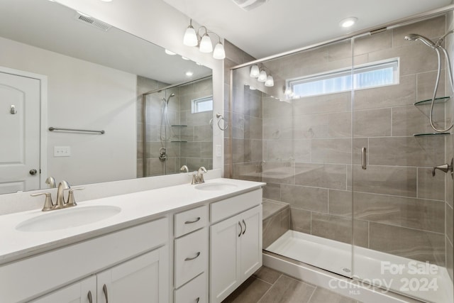 bathroom with vanity and walk in shower