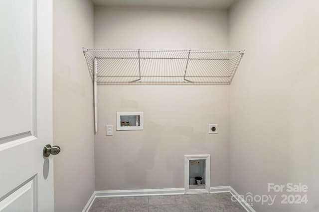 washroom with hookup for an electric dryer and washer hookup