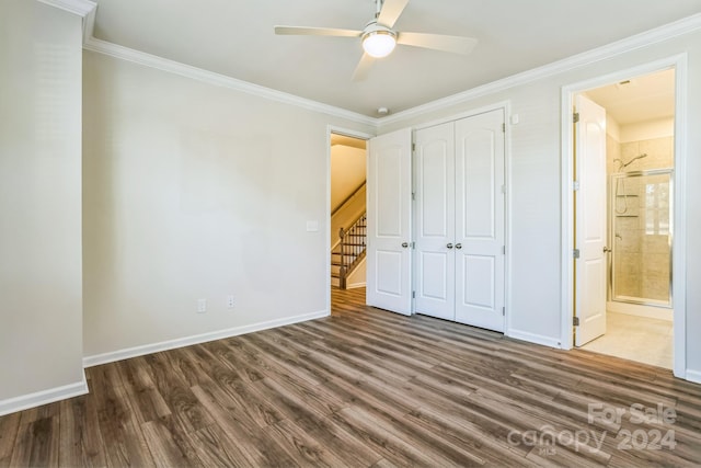 unfurnished bedroom with a closet, ensuite bathroom, ceiling fan, and dark hardwood / wood-style floors