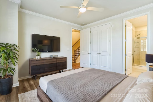 bedroom featuring hardwood / wood-style floors, ceiling fan, ornamental molding, and ensuite bath