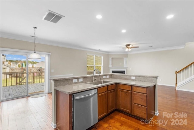 kitchen featuring stainless steel dishwasher, ceiling fan, dark wood-type flooring, sink, and decorative light fixtures