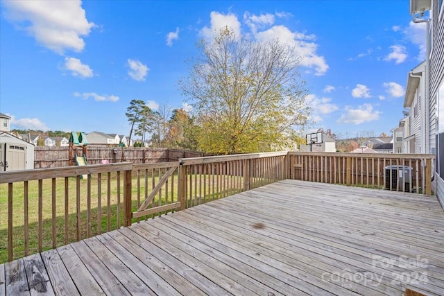 wooden terrace with a yard