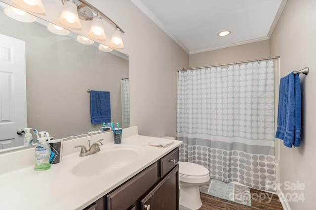 bathroom with a shower with curtain, crown molding, wood-type flooring, toilet, and vanity