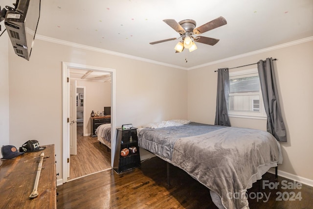 bedroom with ceiling fan, ornamental molding, and dark wood-type flooring