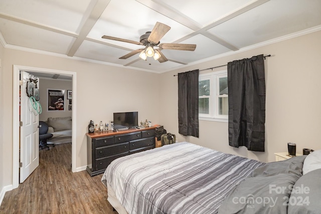 bedroom with ceiling fan, crown molding, wood-type flooring, and coffered ceiling