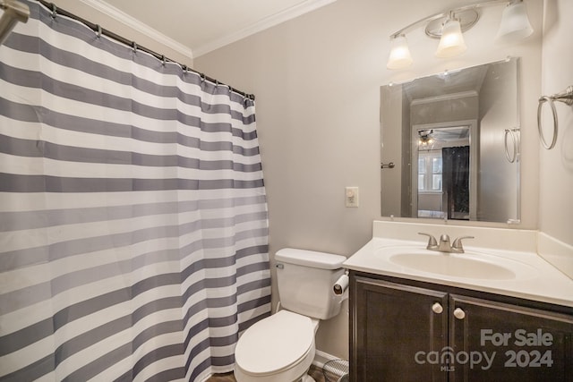 bathroom with vanity, crown molding, ceiling fan, and toilet