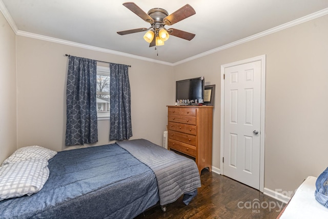 bedroom with ceiling fan, dark hardwood / wood-style floors, and crown molding