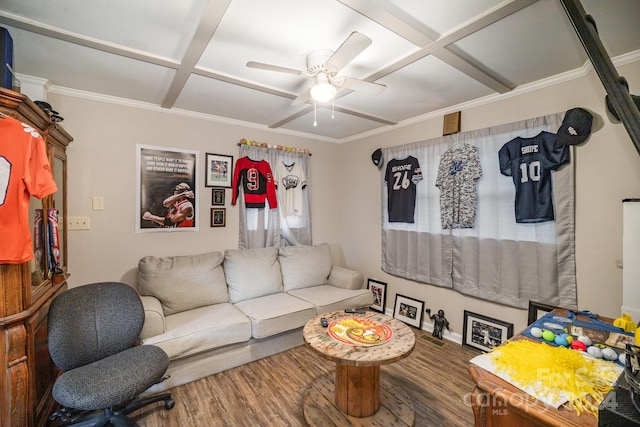 living room featuring hardwood / wood-style flooring, crown molding, ceiling fan, and coffered ceiling