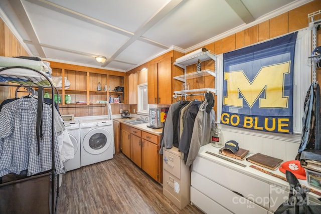 laundry room with dark hardwood / wood-style flooring, washer and clothes dryer, ornamental molding, and sink