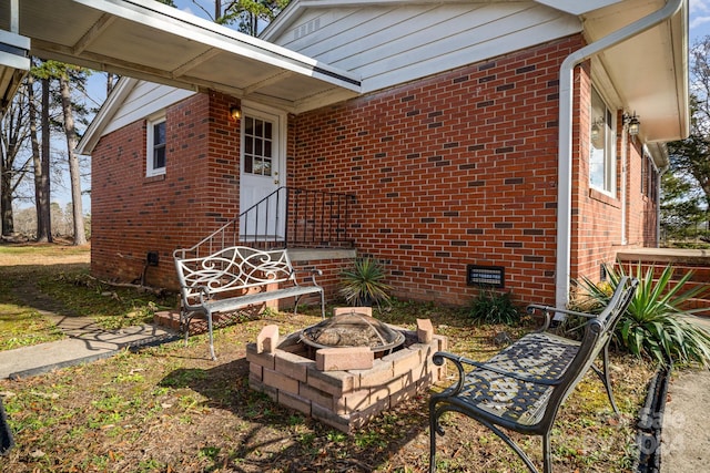 exterior space featuring an outdoor fire pit