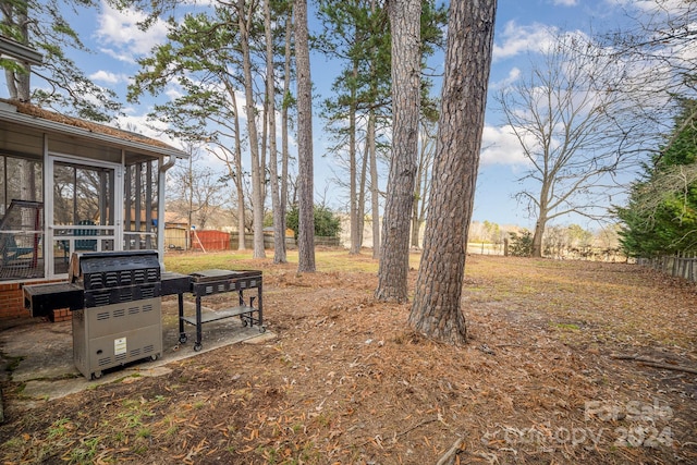 view of yard featuring a sunroom