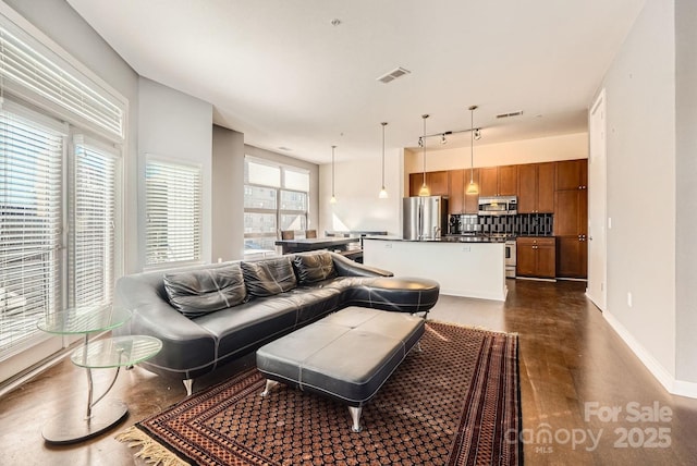 living room with plenty of natural light