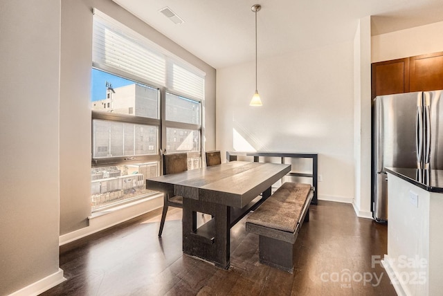 dining space featuring plenty of natural light