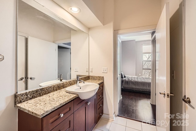 bathroom with tile patterned flooring and vanity