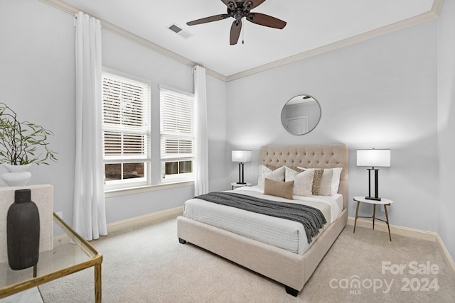 bedroom featuring light carpet, ceiling fan, and crown molding