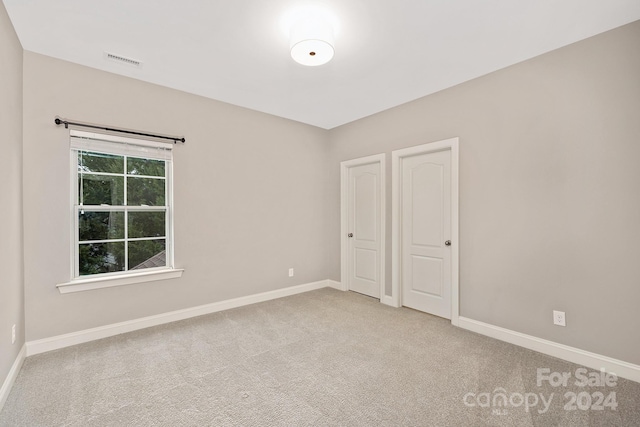 unfurnished bedroom with carpet floors