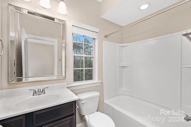 full bathroom with vanity, shower / bath combination, and toilet