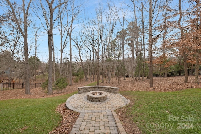 view of yard with a fire pit