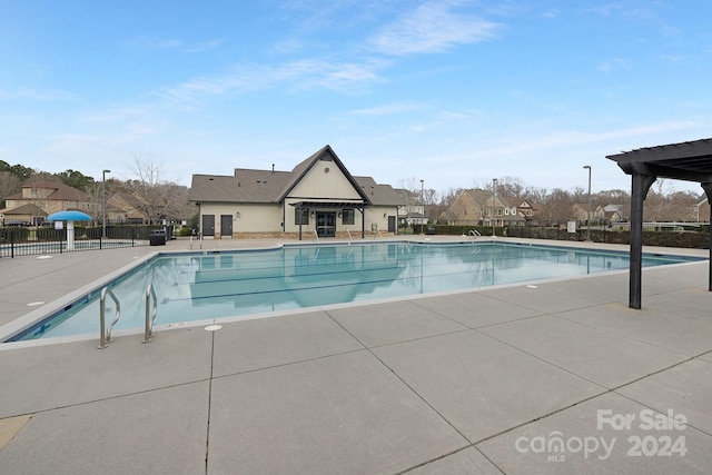 view of swimming pool with a patio area