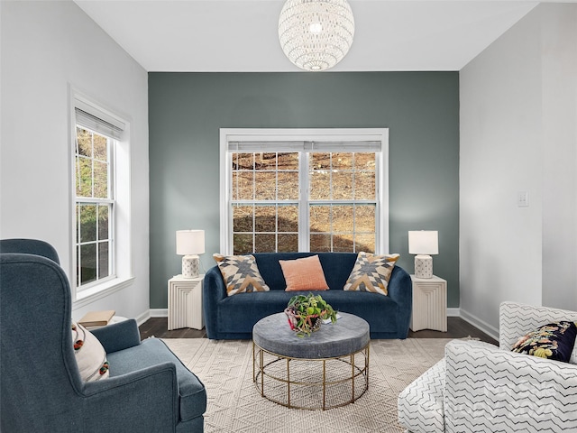 living room with hardwood / wood-style floors and a chandelier