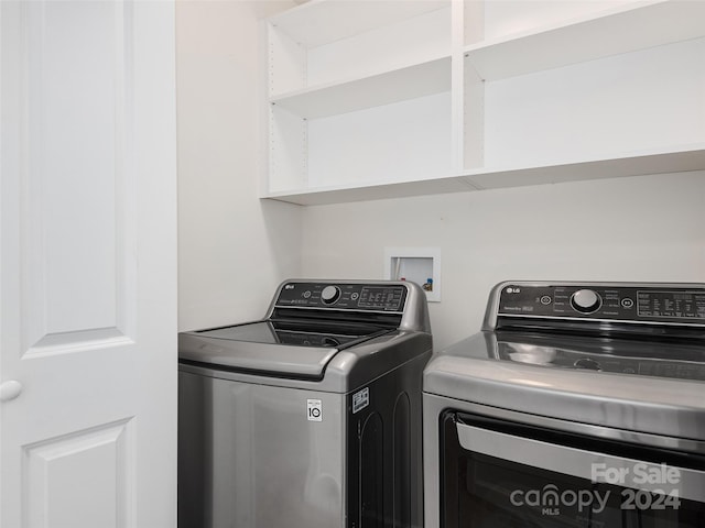 clothes washing area featuring washer and clothes dryer