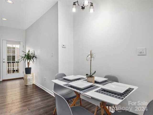 office with a notable chandelier and dark hardwood / wood-style flooring