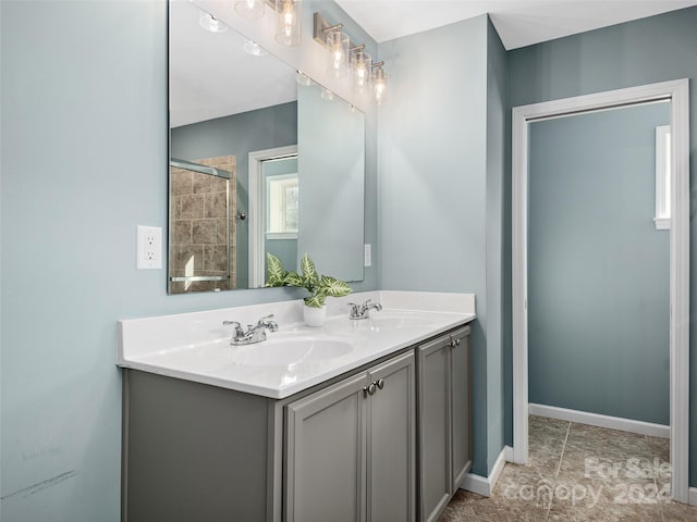 bathroom featuring tile patterned floors and vanity