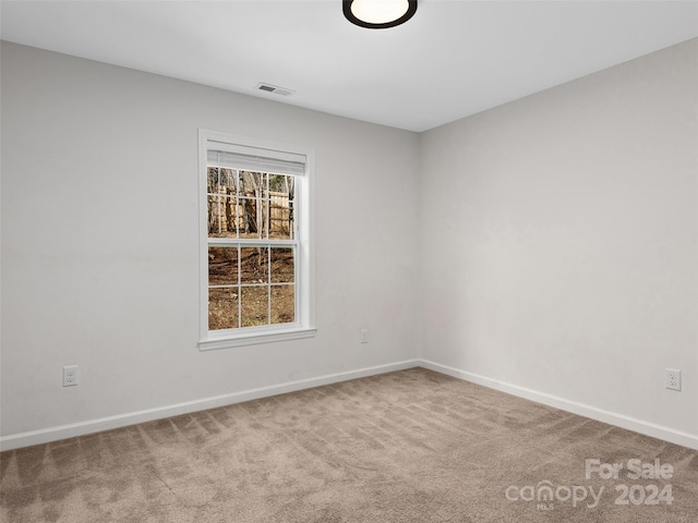 unfurnished room with carpet floors