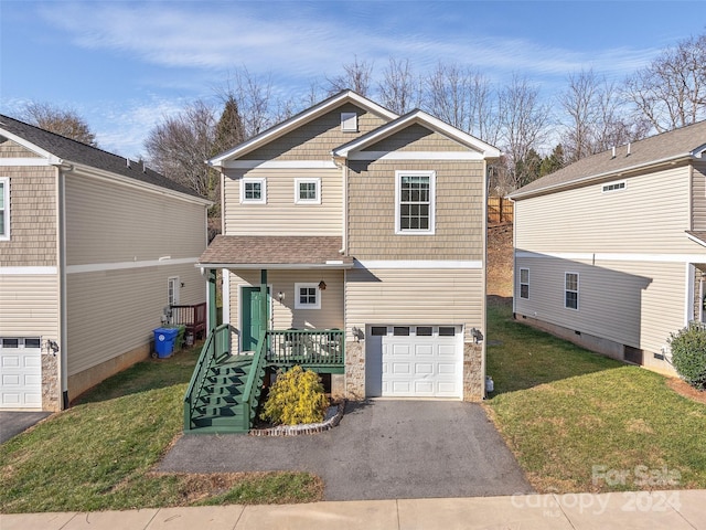 view of front facade with a front yard and a garage