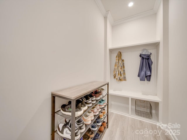 mudroom with light hardwood / wood-style flooring and ornamental molding