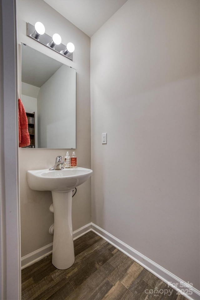 bathroom with hardwood / wood-style floors